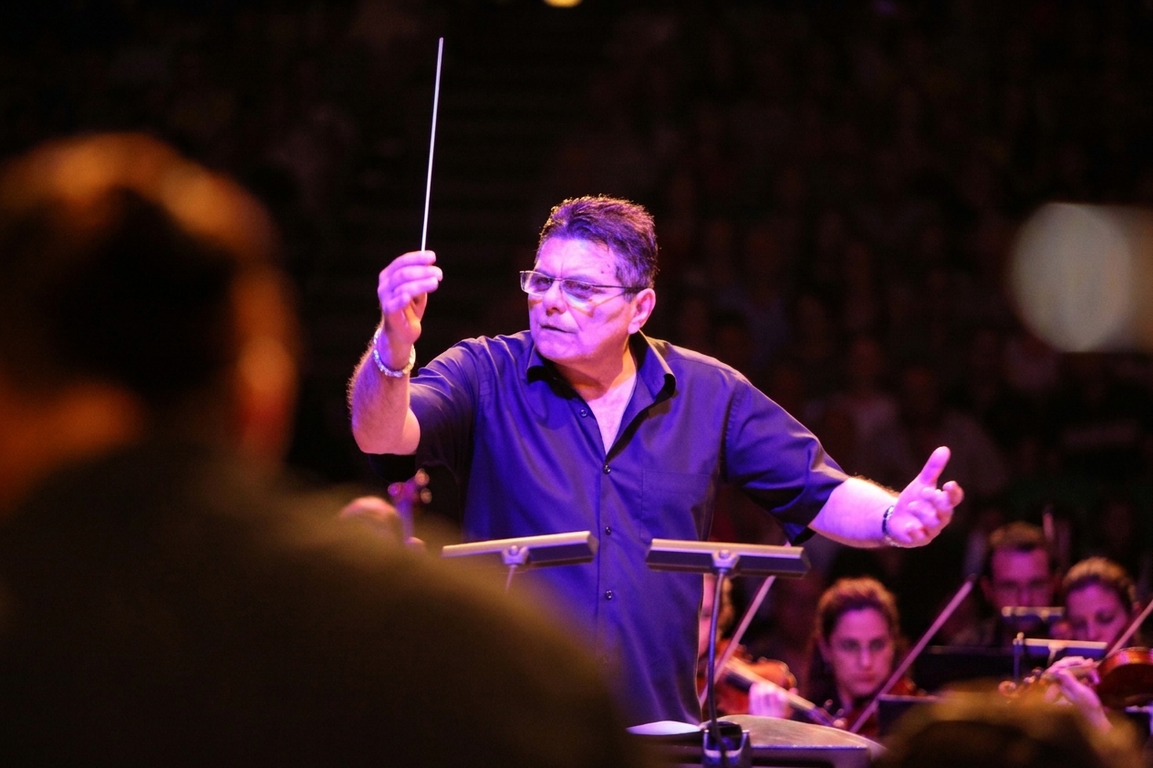 Mro. Joe Brown conducting an orchestra